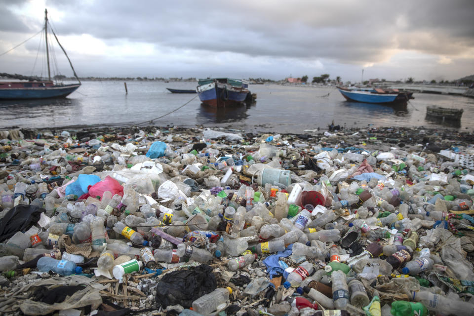 FILE - Litter and debris blanket the shoreline in Cap-Haitien, Haiti, March 10, 2022. Negotiators from around the world gather at UNESCO in Paris on Monday, May 29, 2023, for a second round of talks aiming toward a global treaty on fighting plastic pollution in 2024. (AP Photo/Odelyn Joseph, File)