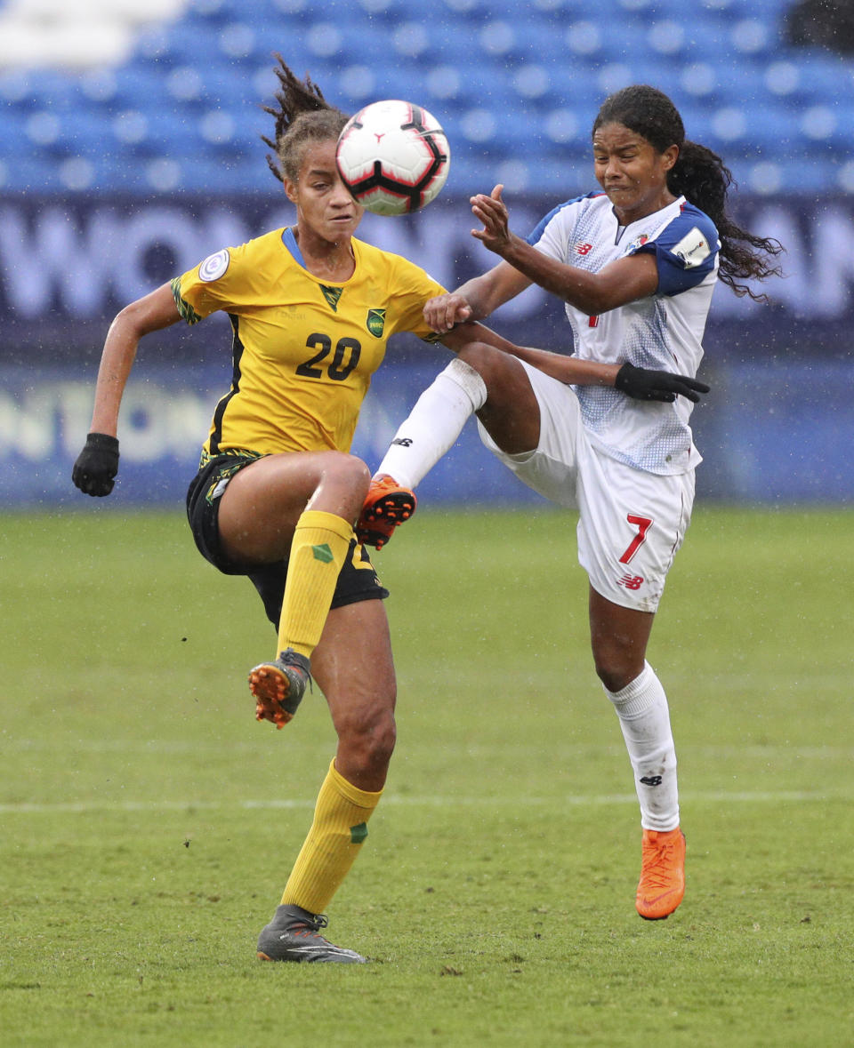 Jamaica midfielder Giselle Washington (20) and Panama midfielder Kenia Rangel (7) battle for the ball during the first half of the third place match of the CONCACAF women's World Cup qualifying tournament, Wednesday, Oct. 17, 2018, in Frisco, Texas. (AP Photo/Richard W. Rodriguez)