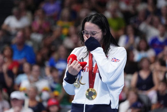 Alice Tai celebrates her gold medla win for ParalympicsGB in the 100m S8 backstroke