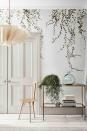 <p>Delicate botanical prints feel contemporary when paired with slender furniture and modern accessories. </p><p>The flowing, natural forms of this elegant wallpaper mural look dramatic surrounding a hall doorway. Pale wood and glass add to the light and airy feel.<br></p>