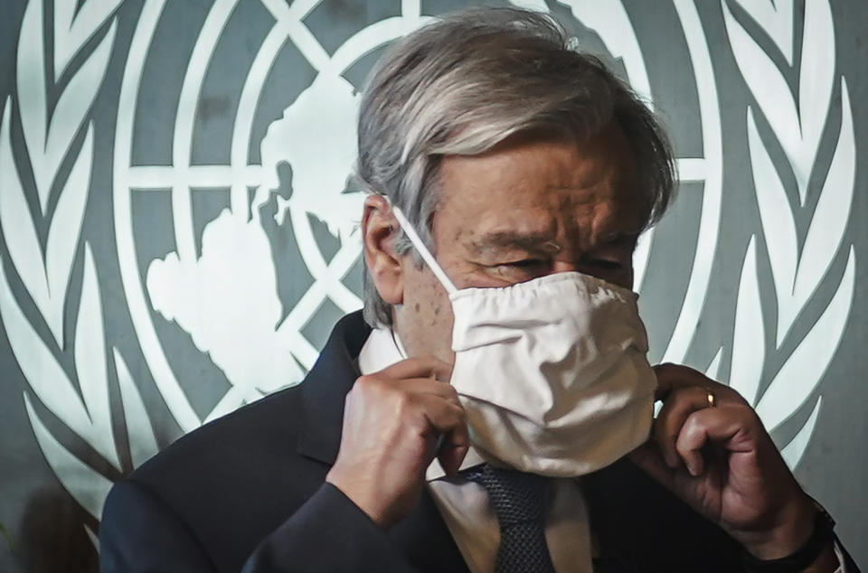 United Nations Secretary-General António Guterres adjusts his face mask following an interview, Wednesday Oct. 21, 2020, at U.N. headquarters. (AP Photo/Bebeto Matthews)