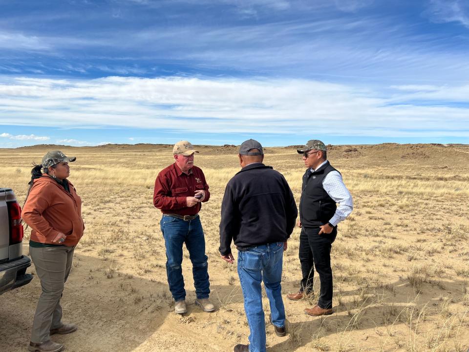 From left, Shaylene Paul and Mike Lisk of Remote Well Solutions, Ferdinand Notah of the Navajo Nation Department of Agriculture and former Navajo Nation Vice President Myron Lizer discuss the installation of an off-grid water production system that will help improve tribal ranches.