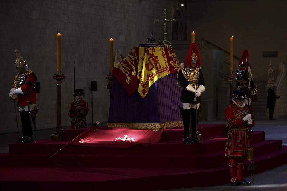 The coffin carrying Queen Elizabeth II rests in Westminster Hall for the lying in state, in London, Wednesday, Sept. 14, 2022. (Dan Kitwood/Pool via AP)