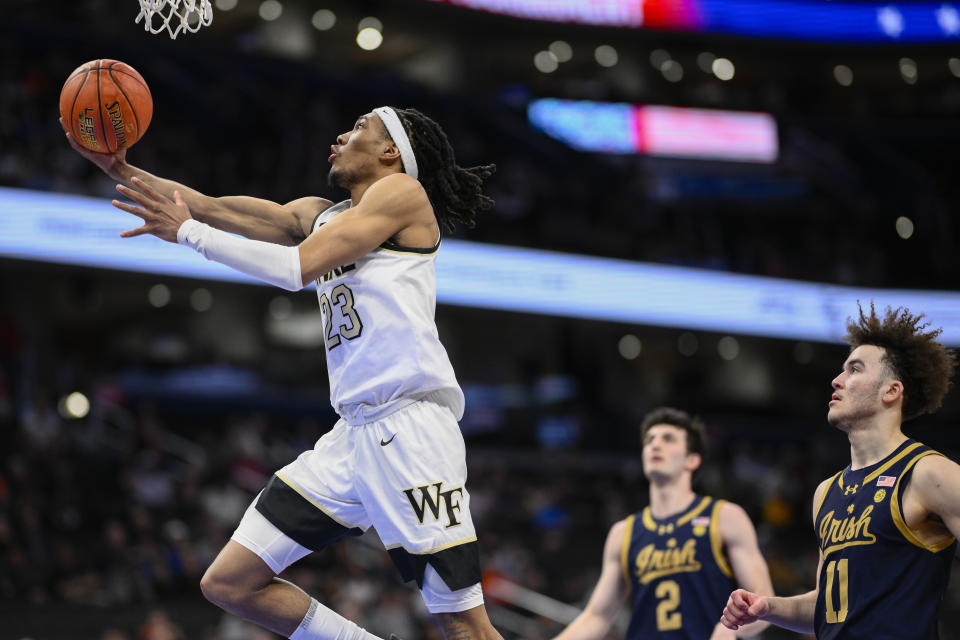 Wake Forest guard Hunter Sallis (23) shoots in front of Notre Dame guards Logan Imes (2) and Braeden Shrewsberry (11) during the second half of the Atlantic Coast Conference second round NCAA college basketball tournament game Wednesday, March 13, 2024, in Washington. (AP Photo/Nick Wass)