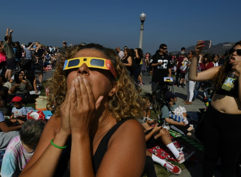 Emotional stargazers watched the celestial show unfold from the Griffith Observatory in Los Angeles