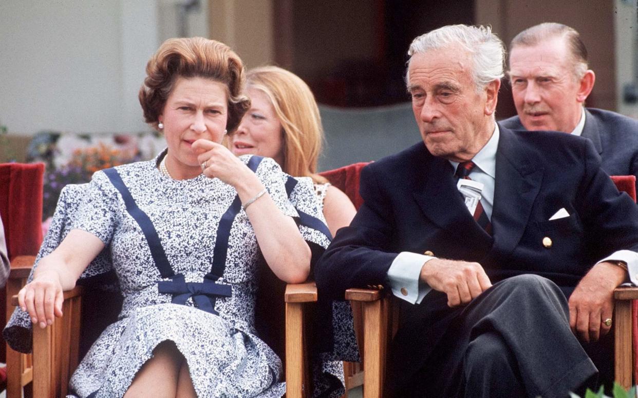 Queen Elizabeth II chats with Lord Louis Mountbatten at the Guards Polo Club in Windsor, in 1975, eight years after the plot to topple Harold Wilson - Getty Images