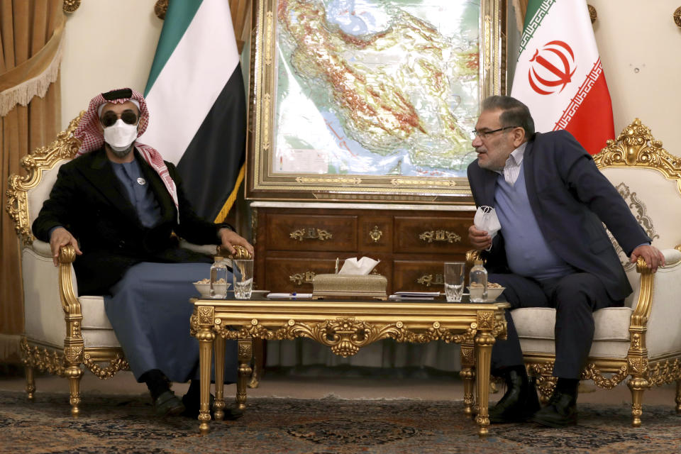 Secretary of Iran's Supreme National Security Council Ali Shamkhani, right, speaks with United Arab Emirates' top national security adviser Sheikh Tahnoon bin Zayed Al Nahyan during their meeting in Tehran, Iran, Monday, Dec. 6, 2021. Sheikh Tahnoon's visit comes as the Emirates and Saudi Arabia both negotiate with Iran amid efforts in Vienna to save Tehran’s tattered nuclear deal with world powers. (AP Photo/Vahid Salemi)