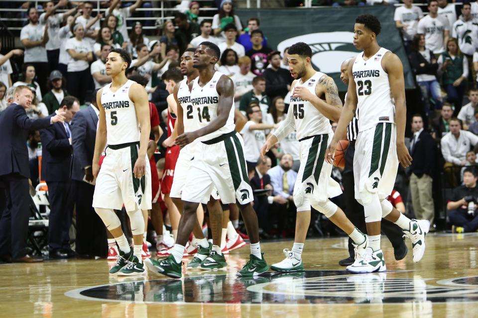 From left, Bryn Forbes, Javon Bess, Eron Harris, Denzel Valentine and Deyonta Davis of the Michigan State Spartans walk to the bench against the Nebraska Cornhuskers on Jan. 20, 2016.