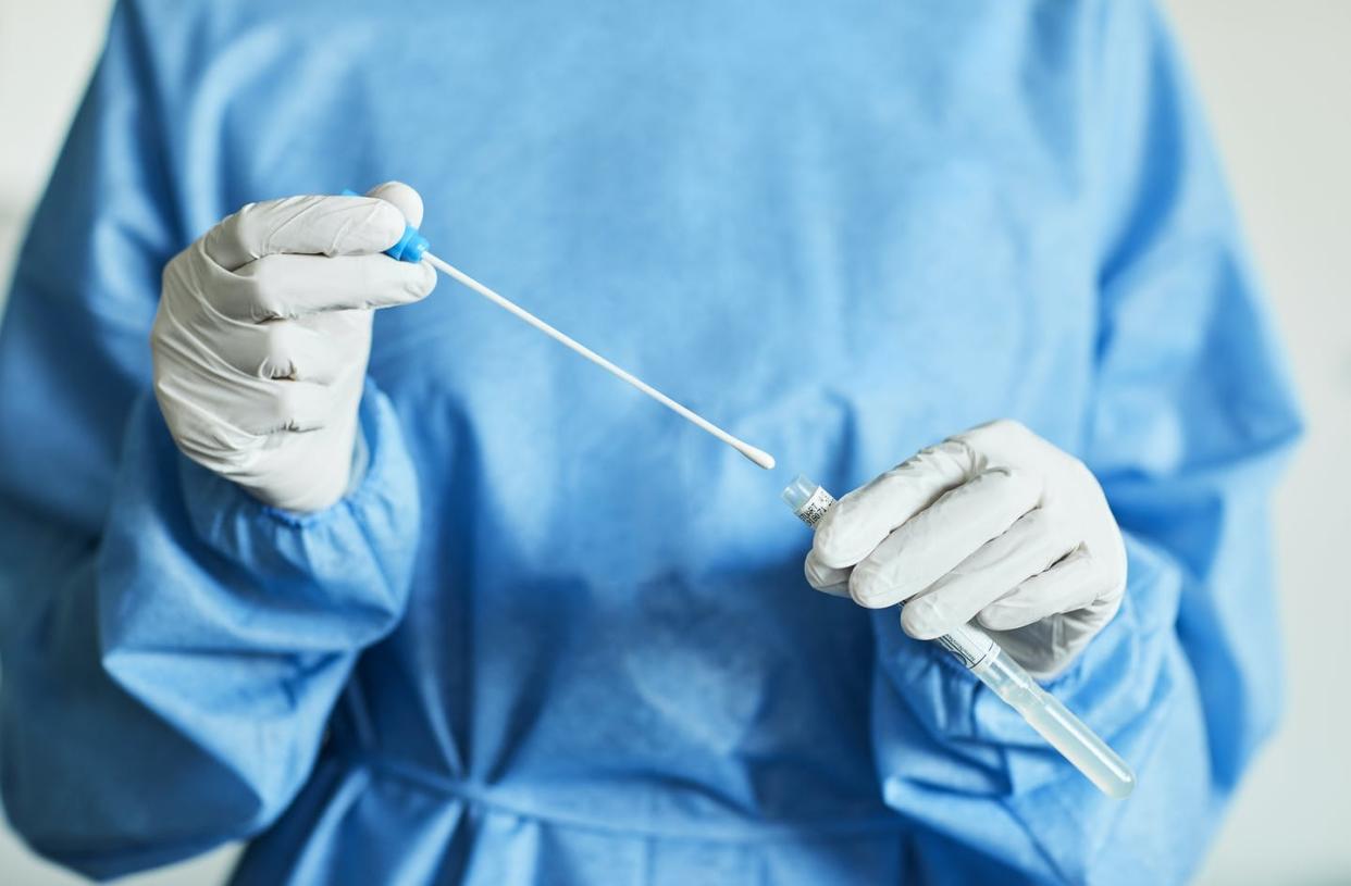 <span class="caption">All COVID-19 tests start with a sample, but the scientific process goes very differently after that.</span> <span class="attribution"><a class="link " href="https://www.gettyimages.com/detail/photo/doctor-nurse-with-swab-test-sample-in-hospital-pcr-royalty-free-image/1296010648?adppopup=true" rel="nofollow noopener" target="_blank" data-ylk="slk:Morsa Images/Digital Vision via Getty Images;elm:context_link;itc:0;sec:content-canvas"> Morsa Images/Digital Vision via Getty Images</a></span>