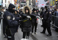 <p>Spectators pass through security screening ahead of the New Year’s Eve celebration in Times Square in New York, on Sunday, Dec. 31, 2017. (Photo: Peter Morgan/AP) </p>