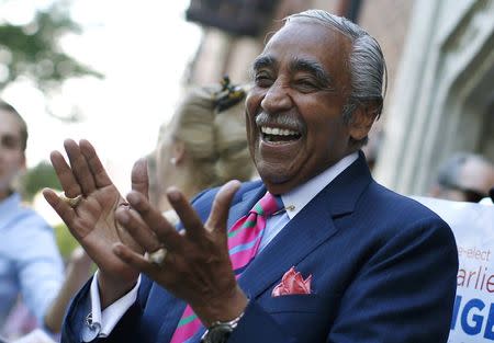 U.S. Representative Charles Rangel (D-NY), who is running for a 23rd term in Congress, makes an early morning campaign stop outside a subway stop in upper Manhattan in New York City before casting his vote in the Democratic Primary election in New York June 24, 2014. REUTERS/Mike Segar