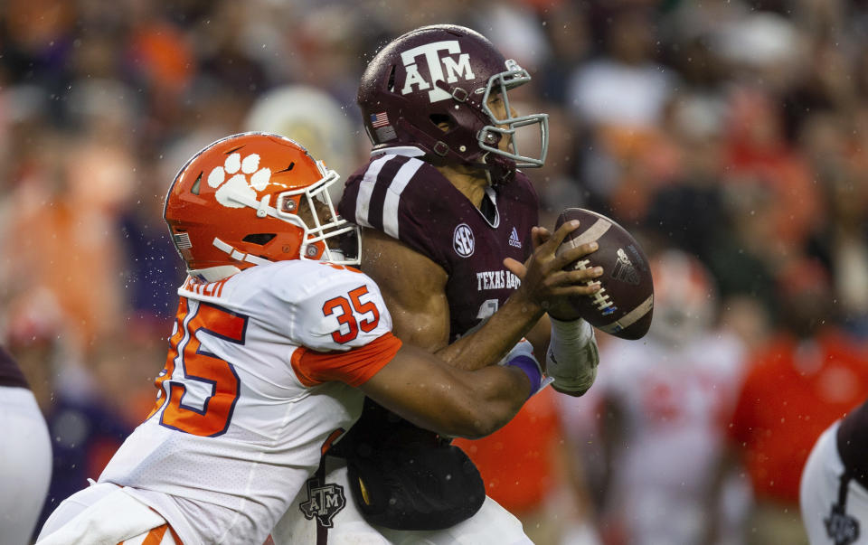 Clemson defensive end Justin Foster (35) sacks Texas A&M quarterback Kellen Mond (11) during the first half of an NCAA college football game Saturday, Sept. 8, 2018, in College Station, Texas. (AP Photo/Sam Craft)