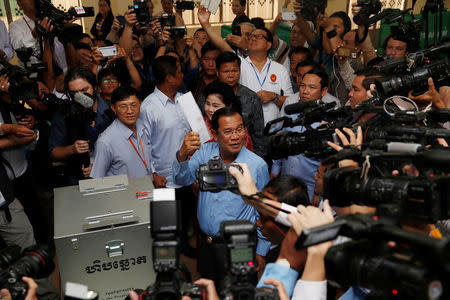 Cambodia's Prime Minister and President of the Cambodian People's Party (CPP) Hun Sen prepares to cast his vote at a polling station during a general election in Takhmao, Kandal province, Cambodia July 29, 2018. REUTERS/Darren Whiteside