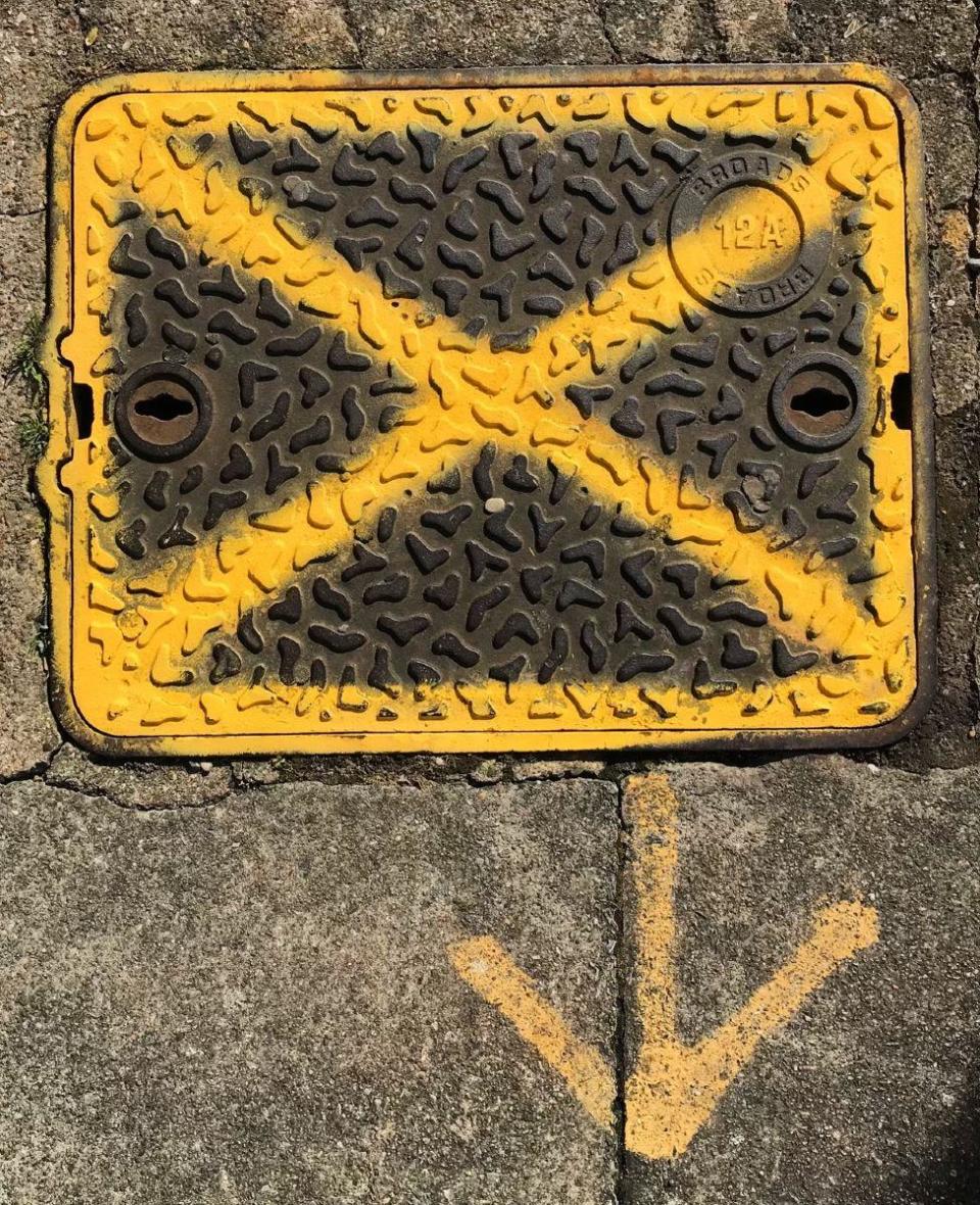 An X sign spray-painted on the ground