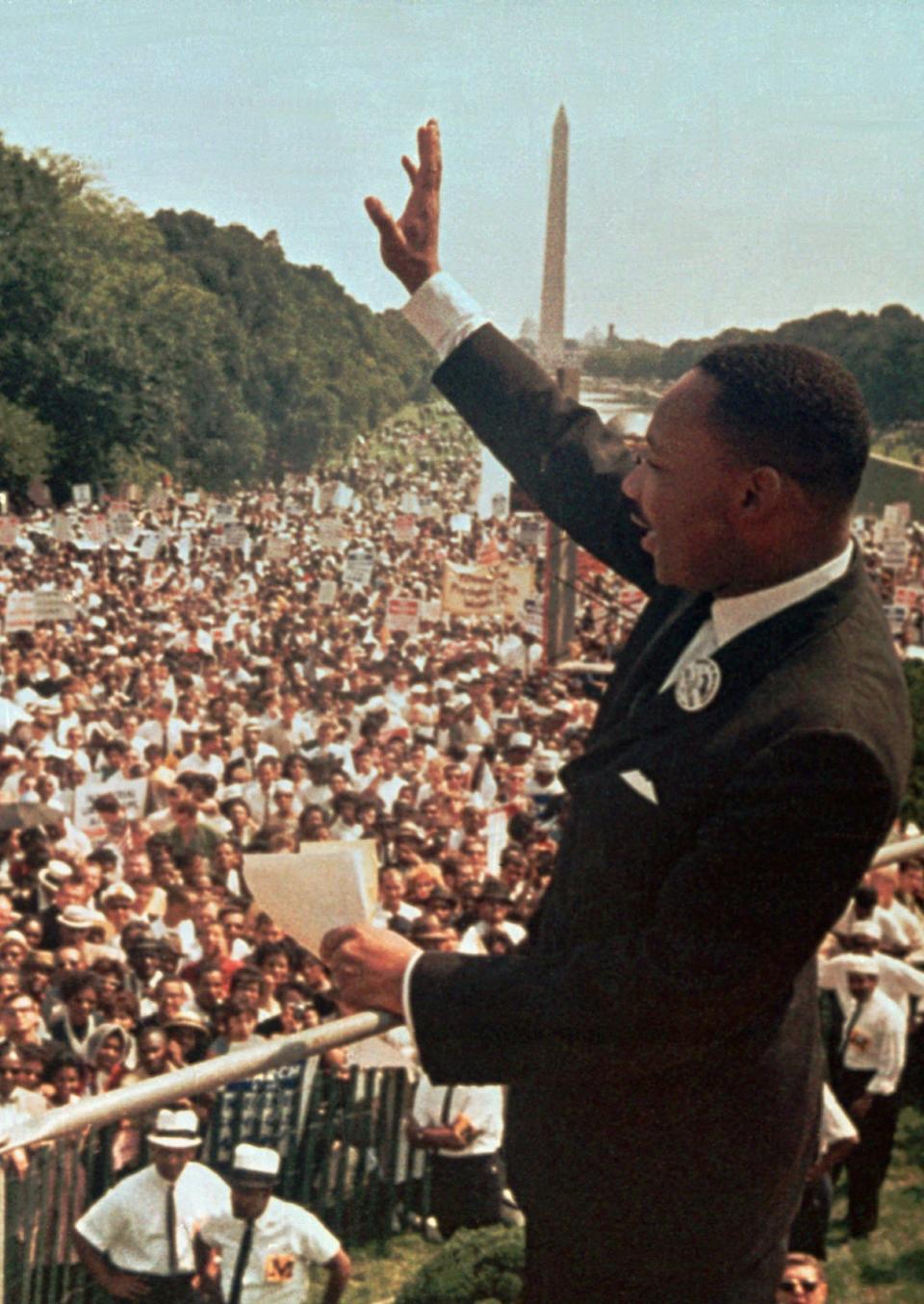 The Rev. Martin Luther King Jr. acknowledges the crowd at the Lincoln Memorial for his "I Have a Dream" speech during the March on Washington in this Aug. 28, 1963, file photo.