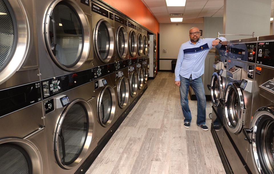 Ankur Shah, owner of  D-Express Laundry, is shown April 23, 2020 at the Millcreek Township business. [JACK HANRAHAN/ERIE TIMES-NEWS]
