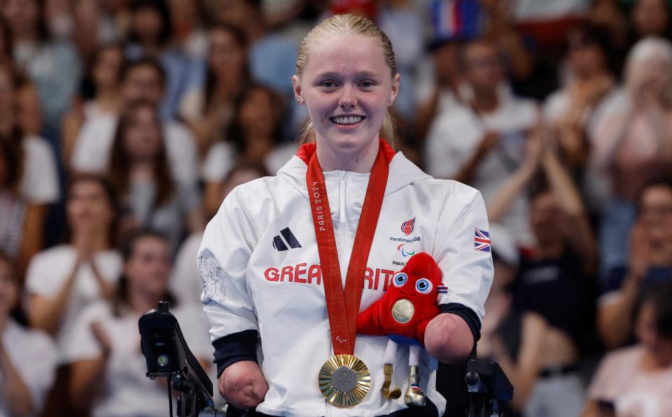 Ellie Challis with her gold medal on the podium