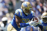 UCLA Bruins defensive lineman Datona Jackson (58) intercepts a pass during the first half of an NCAA college football game against the Hawaii Warriors Saturday, Aug. 28, 2021, in Pasadena, Calif. (AP Photo/Ashley Landis)