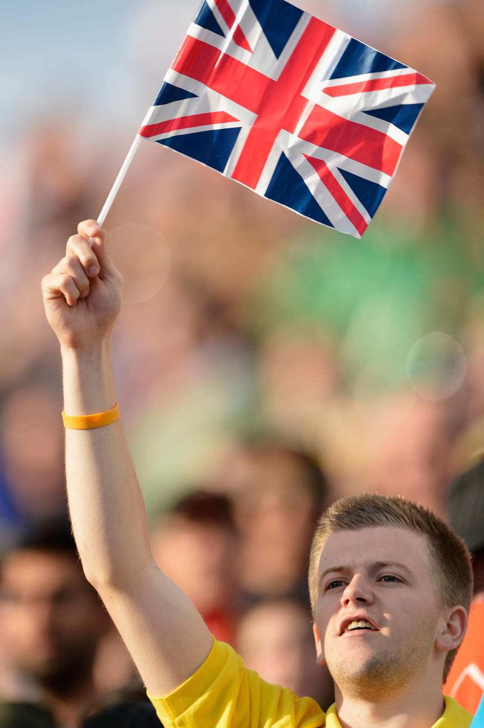 LONDON, ENGLAND - JULY 29: A supporter holds a British flag during the women's match between Great Britain and Japan at Hockey Centre on July 29, 2012 in London, England. (Photo by Pascal Le Segretain/Getty Images)