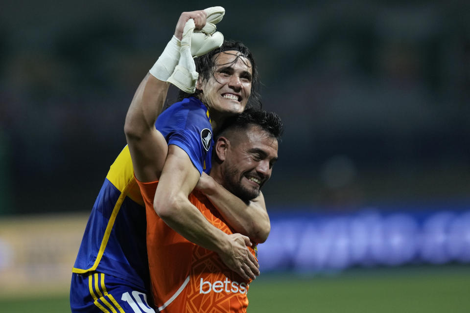 Edinson Cavani of Argentina's Boca Juniors embraces goalkeeper Sergio Romero after defeating Brazil's Palmeiras in a penalty shootout during a Copa Libertadores semifinal second leg soccer match at Allianz Parque stadium in Sao Paulo, Brazil, Thursday, Oct. 5, 2023. (AP Photo/Andre Penner)