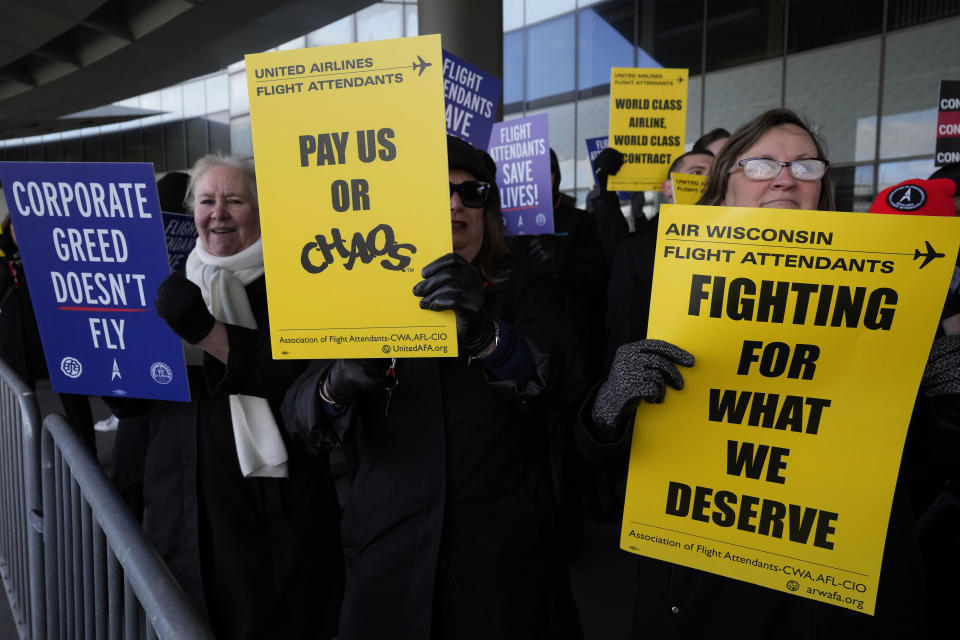 Hundreds of flight attendants protest at O'Hare International Airport in Chicago, Tuesday, Feb. 13, 2024. They represent three different unions and work for several airlines including Southwest, American, and United. Each of the unions are in contract negotiations with the airlines and pushing for fair contracts. (AP Photo/Nam Y. Huh)