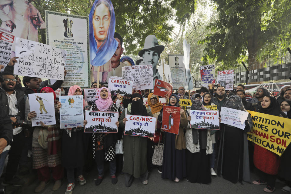 Students shout slogans against government during a protest against a new citizenship law in New Delhi, India, Tuesday, Dec. 24, 2019. Hundreds of students marched Tuesday through the streets of New Delhi to Jantar Mantar, an area designated for protests near Parliament, against the new citizenship law, that allows Hindus, Christians and other religious minorities who are in India illegally to become citizens if they can show they were persecuted because of their religion in Muslim-majority Bangladesh, Pakistan and Afghanistan. It does not apply to Muslims. (AP Photo/Manish Swarup)