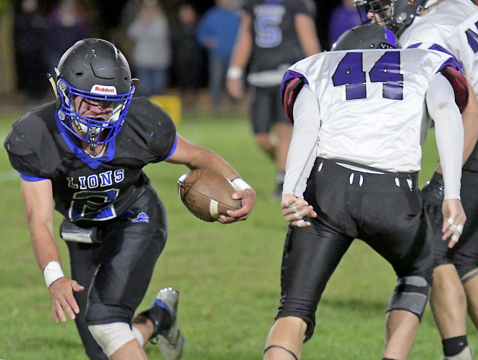 West Boylston's Jamie McNamara slips past Blackstone Valley tacklers, Friday, Sept. 23, 2022.