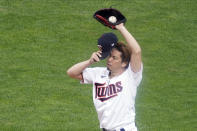 Minnesota Twins pitcher Kenta Maeda, of Japan, composes himself after giving up a walk to Houston Astros' Carlos Correa to load the bases in the fourth inning in Game 1 of the American League wild-card baseball series, Tuesday Sept. 29, 2020, in Minneapolis. (AP Photo/Jim Mone)