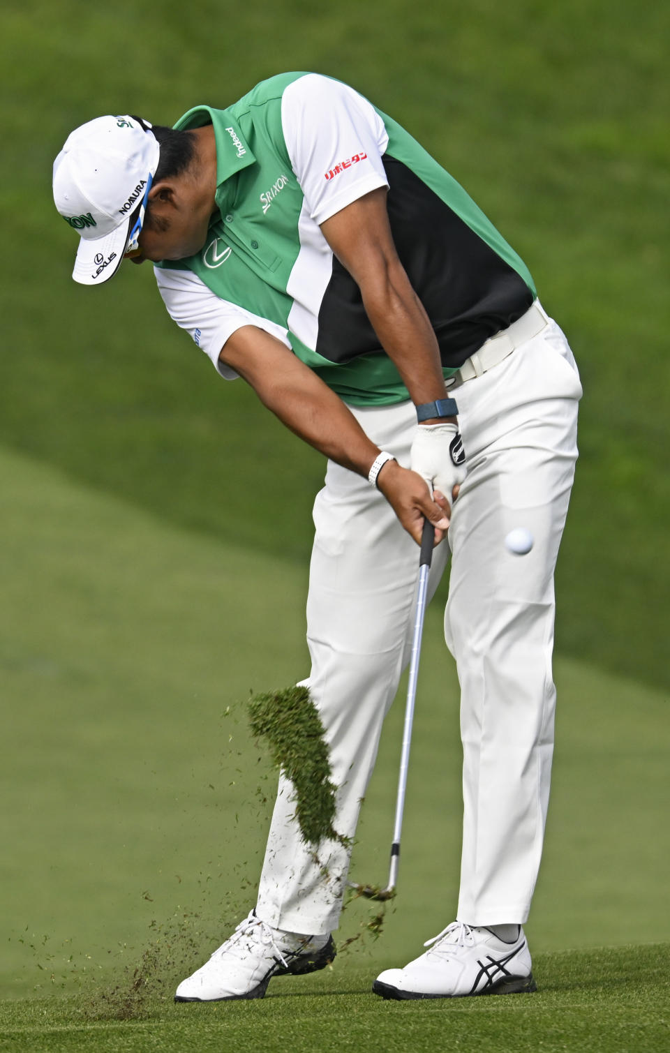 Hideki Matsuyama, of Japan, hits his second shot on the 13th hole of the South Course during the third round of the Farmers Insurance Open golf tournament, Friday Jan. 28, 2022, in San Diego. (AP Photo/Denis Poroy)