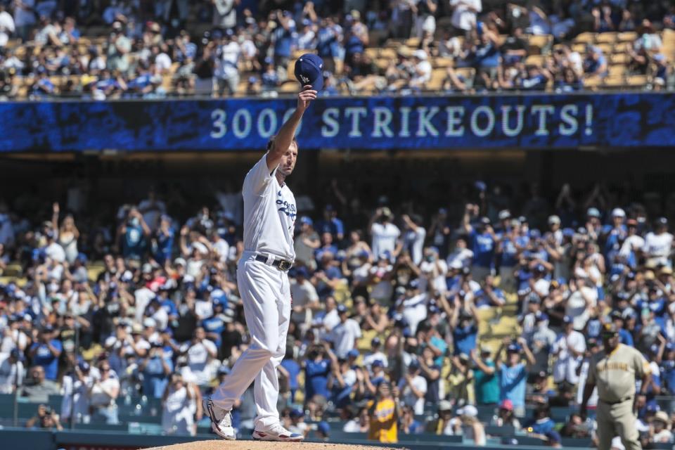 Dodgers starting pitcher Max Scherzer salutes the crowd after striking out San Diego Padres first baseman Eric Hosmer.