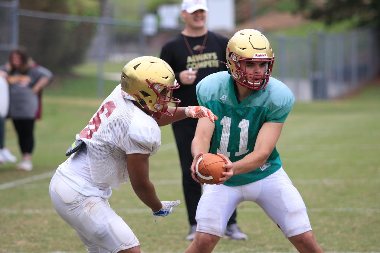 Dylan Lonergan runs a read option play during spring practice at Brookwood last week.