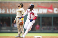 Atlanta Braves Marcell Ozuna (20) and San Diego Padres second baseman Robinson Cano (24) looks at home run ball hit during the fourth inning of a baseball game Sunday, May 15, 2022, in Atlanta. (AP Photo/Hakim Wright Sr)