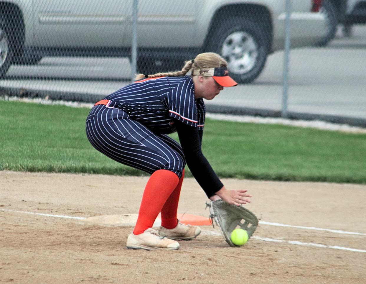 Pontiac first baseman Cadence Helms fields a grounder during a game against Lincoln.