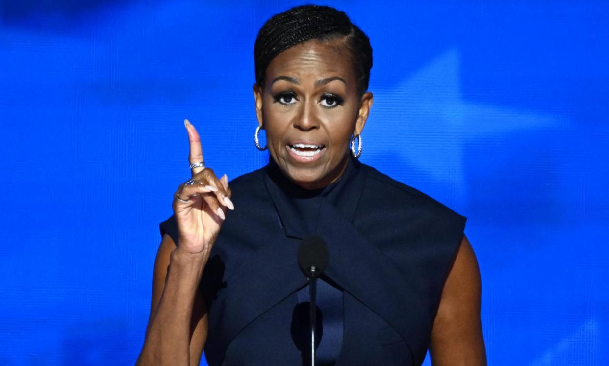 <span>The former first lady Michelle Obama speaks on the second day of the Democratic national convention in Chicago on Tuesday night.</span><span>Photograph: Mandel Ngan/AFP/Getty Images</span>