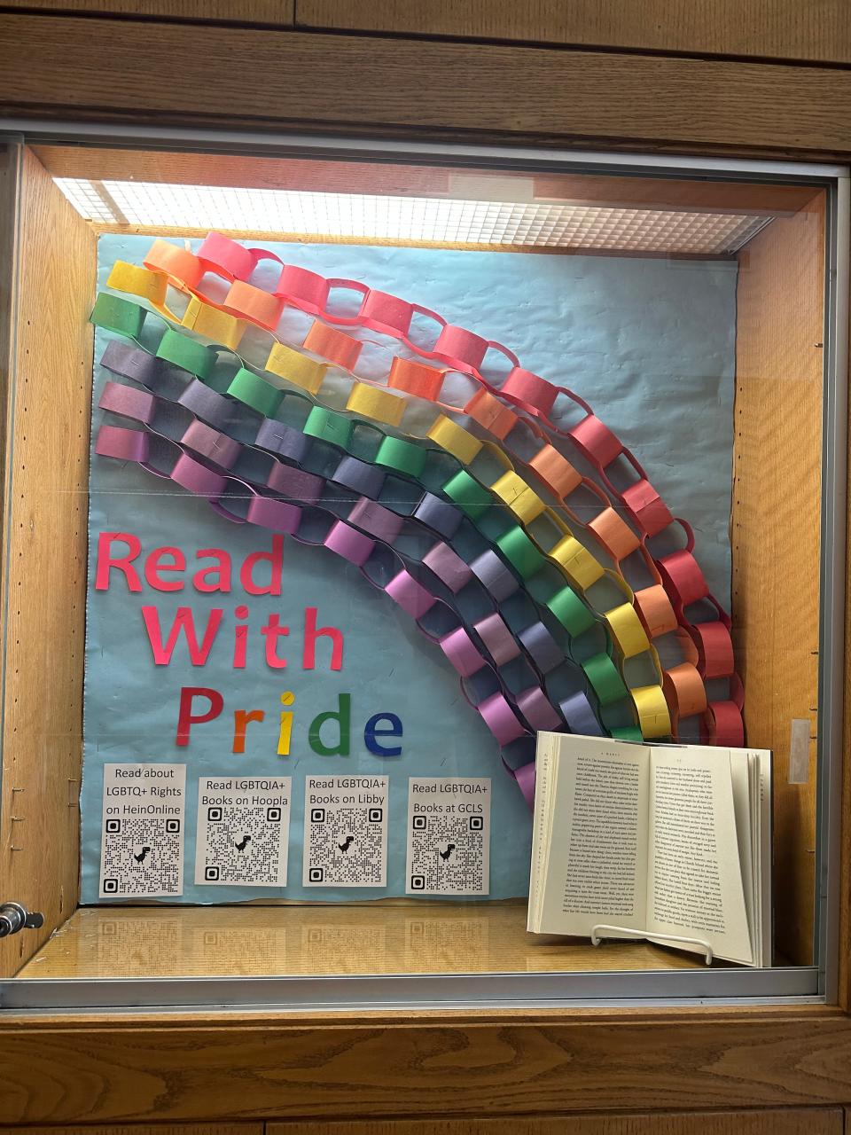 The current Travelers Rest foyer has a display that says "Read with Pride", with ribbons in rainbow colors.