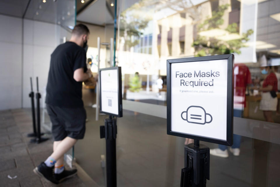 A sign on display advises the public to the requirements of face masks on December 24, 2021 in Perth, Australia. 