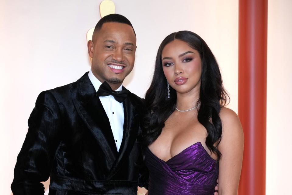 <p>Kevin Mazur/Getty</p> Terrence J and Mikalah Sultan attend the 95th Annual Academy Awards.