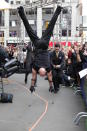 Rokardy Rodriguez, one of the stars of Cirque du Soleil's "Viva Elvis," attempted to break his own record for using hand stilts to walk 50 meters today in Times Square.