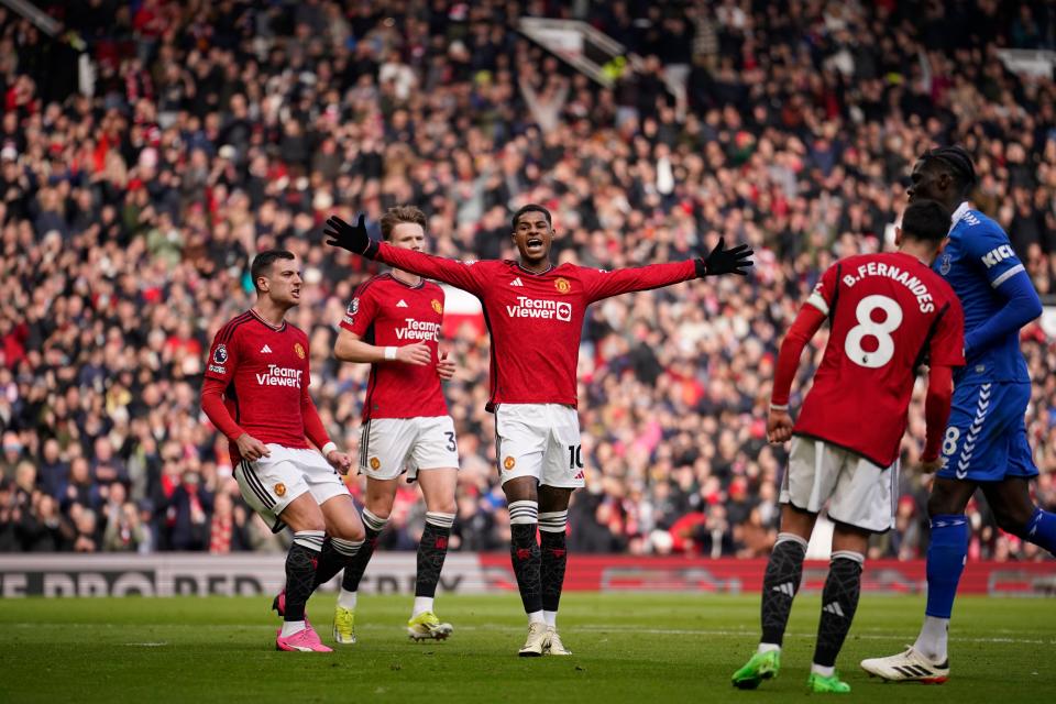 Rashford celebrates after converting from the spot (AP)