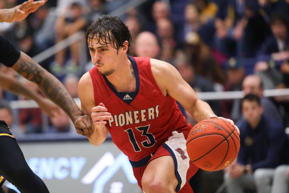 Malone's Simon Blair drives to the basket during Monday's game ar Kent State,