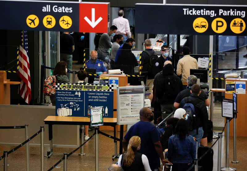 Travelers at Seattle-Tacoma International Airport in SeaTac