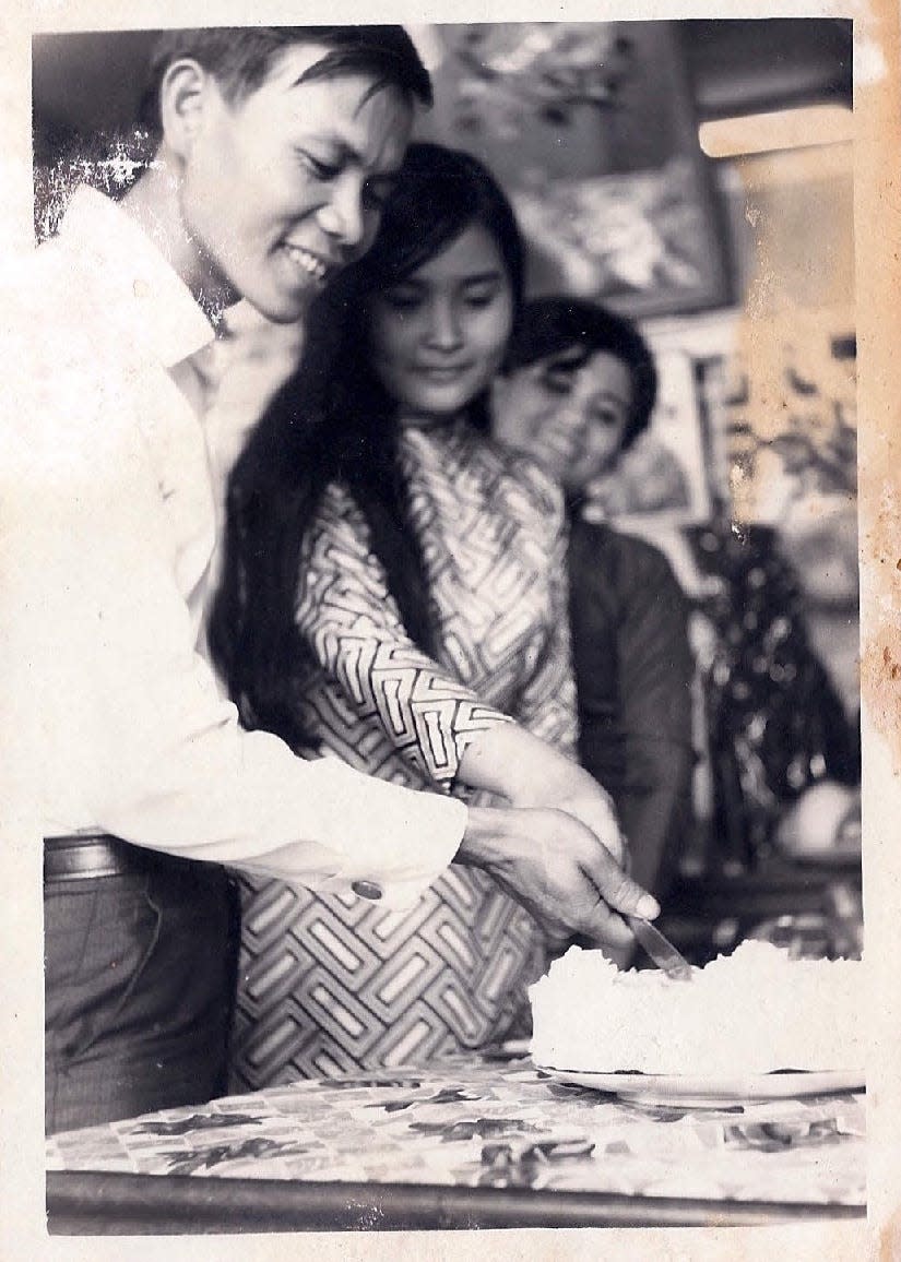 Hue Che, left, and Hoa Le celebrate their engagement in 1974 in Saigon, which fell a year later to North Vietnamese communist forces.