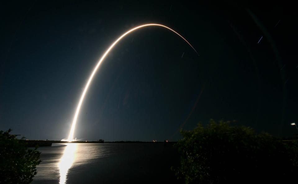 A time-lapse image of Sunday's SpaceX Falcon 9 rocket arcing across the sky from Kennedy Space Center.