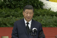 In this image taken from video footage run by China's CCTV, Chinese President Xi Jinping speaks during a formal memorial for the late former Chinese President Jiang Zemin at the Great Hall of the People in Beijing on Tuesday, Dec. 6, 2022. (CCTV via AP)