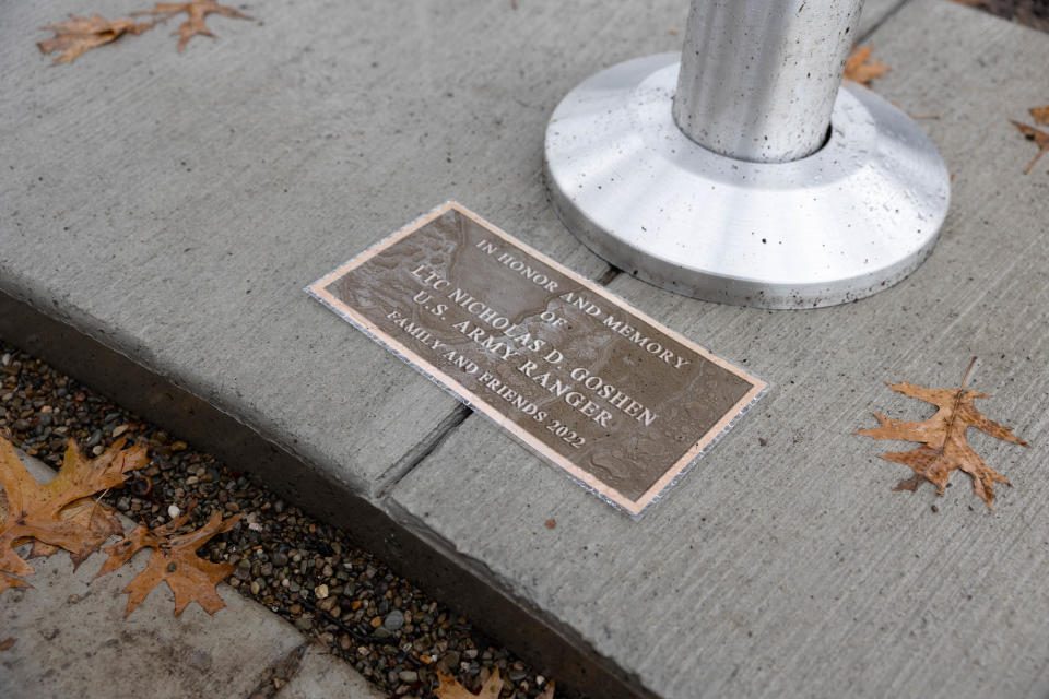 A temporary plaque lays at the base of the newly erected flagpole dedicated to Army Ltc. Nicholas Goshen at the Village of Silver Lake Veterans Tribute Garden. A dedication ceremony was held on Veterans Day.