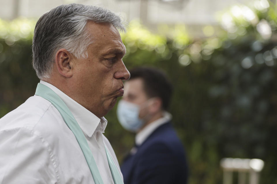 Hungary's Prime Minister Viktor Orban arrives for an EU summit in Brussels, Monday, July 20, 2020. Leaders from 27 European Union nations stretch their meeting into a fourth day on Monday to assess an overall budget and recovery package spread over seven years. (Stephanie Lecocq, Pool Photo via AP)