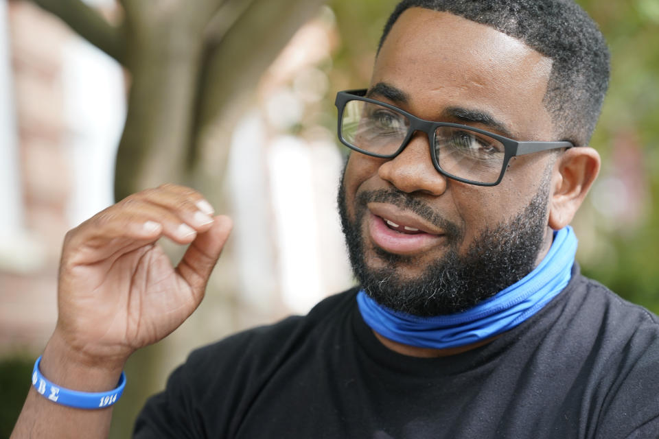 Devon Henry, owner of Henry Enterprises, gestures during an interview Tuesday Sept. 15, 2020, in Richmond, Va. Henry is a Black businessman whose construction company took on a job the city says others were unwilling to do. (AP Photo/Steve Helber)