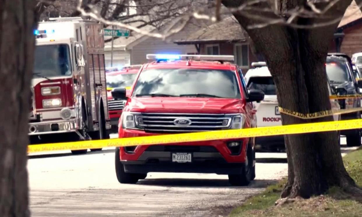 <span>Emergency personnel work at the scene in Rockford on Wednesday where four people were killed and five were wounded in stabbings in northern Illinois.</span><span>Photograph: AP</span>