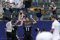 Los Angeles Galaxy midfielder Sebastian Lletget, top center, celebrates with teammates midfielder Samuel Grandsir, bottom center, and forward Javier Hernandez during the first half of a Major League Soccer match against Austin FC Saturday, May 15, 2021, in Carson, Calif. (AP Photo/Mark J. Terrill)