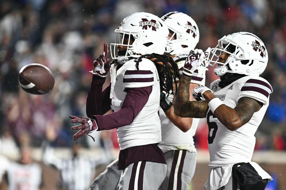 Mississippi State wide receiver Lideatrick Griffin (5) reacts with teammates after a touchdown against Ole Miss at Vaught-Hemingway Stadium.
